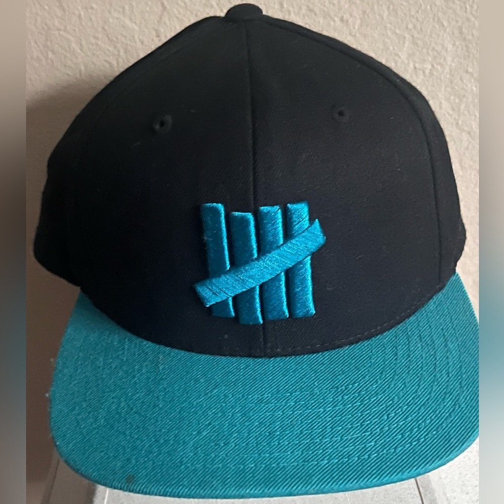 Black and Teal Undefeated 5 Strike Snapback Cap
